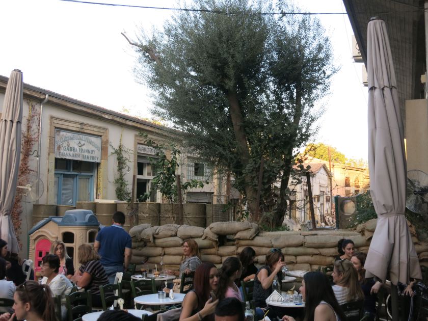 The division cuts streets in half, but life continues as if nothing happened. Café at the UN Buffer Zone in Southern Nikosia, Republic of Cyprus. © Gerrit Kurtz.